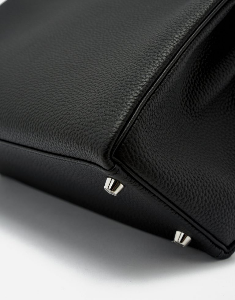 Metal Feet Detail of a Pre-Loved Hermès Kelly 28 Togo in Black on SACLÀB
