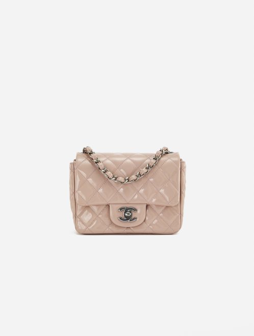 A pre-loved Chanel Timeless Mini Square in Nude Patent Leather on SACLÀB