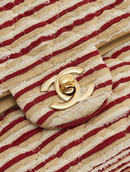 Gold hardware detail on a limited-edition Chanel Timeless Medium made from Fabric and Pearls in Red and White on SACLÀB