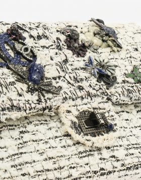Hardware on a pre-loved Chanel 2.55 Reissue 226 Tweed White Black Garden Charms on SACLÀB
