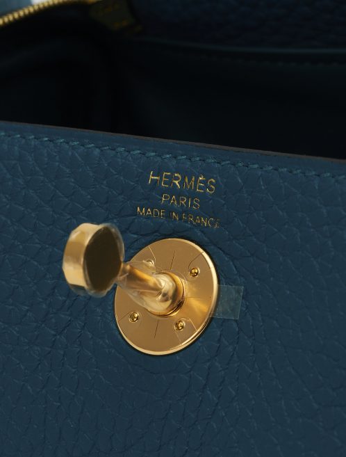 A pre-loved Hermès Lindy Mini Clemence Vert Bosphore on SACLÀB