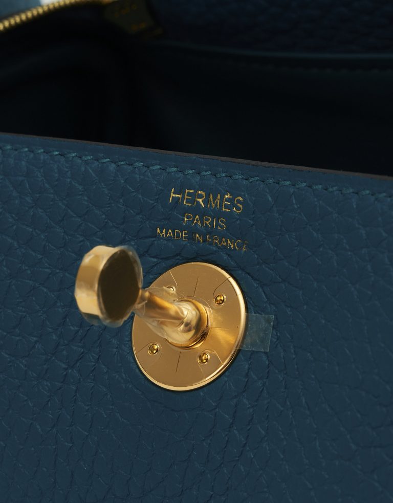 A pre-loved Hermès Lindy Mini Clemence Vert Bosphore on SACLÀB