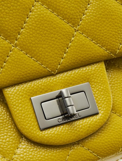 A pre-loved Chanel 2.55 Reissue 227 Patent Caviar Yellow on SACLÀB