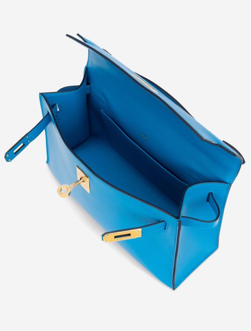 Pre-owned Hermès bag Kelly Pochette Swift Blue Frida Blue | Sell your designer bag on Saclab.com