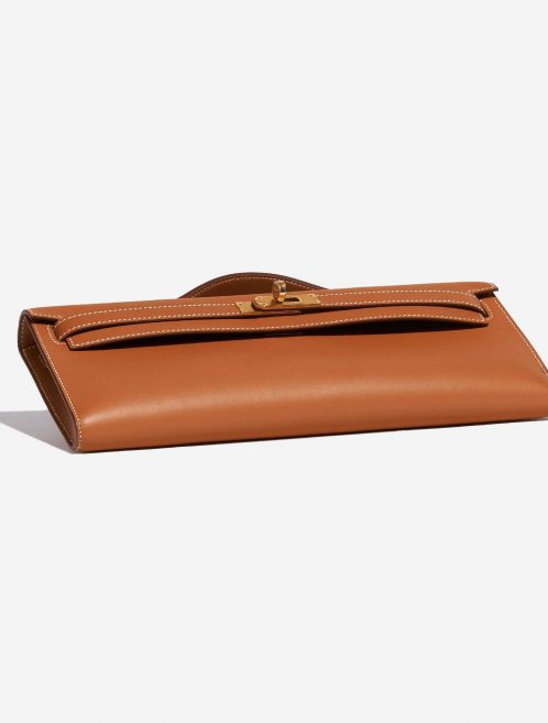 Pre-owned Hermès bag Kelly Cut Clutch Swift Gold Beige, Brown Bottom | Sell your designer bag on Saclab.com