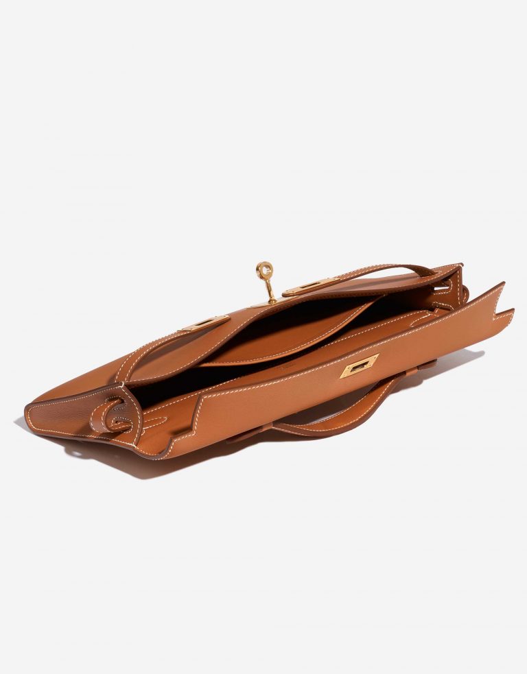 Pre-owned Hermès bag Kelly Cut Clutch Swift Gold Beige, Brown Inside | Sell your designer bag on Saclab.com