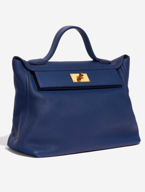 Pre-owned Hermès bag 24/24 35 Clemence / Swift Deep Blue Blue Side Front | Sell your designer bag on Saclab.com