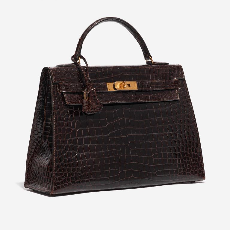 Pre-owned Hermès bag Kelly 32 Porosus Crocodile Dark Brown Brown Side Front | Sell your designer bag on Saclab.com