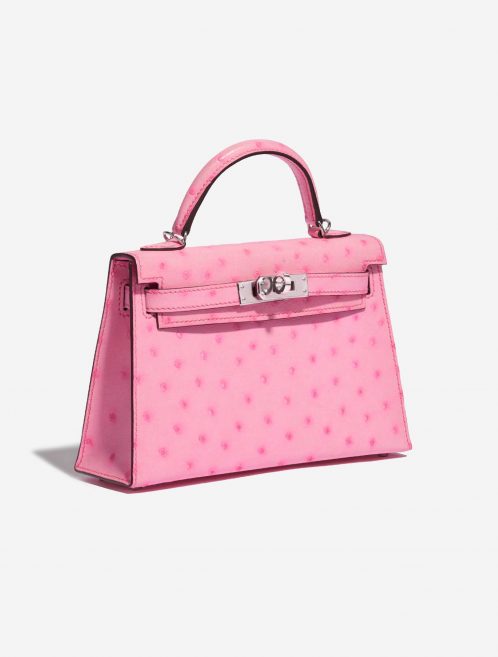 Pre-owned Hermès bag Hermes Kelly Mini 5P Bubblegum Ostrich Pink Side Front | Sell your designer bag on Saclab.com