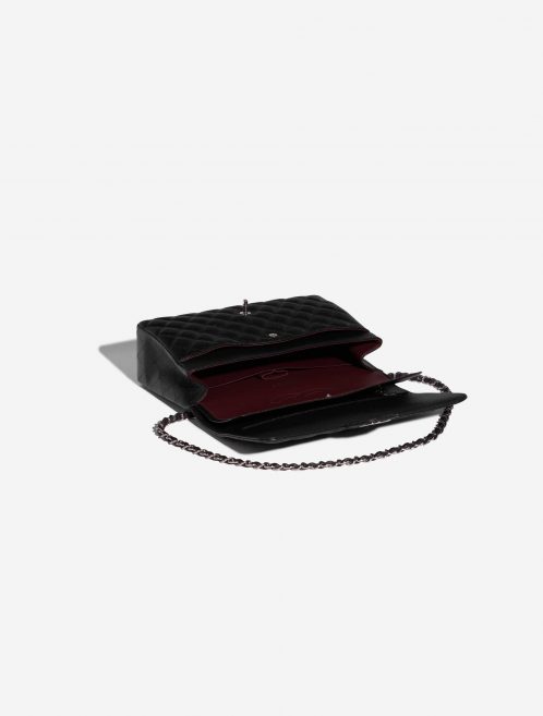 Pre-owned Chanel bag Timeless Maxi Caviar Black Black Inside | Sell your designer bag on Saclab.com