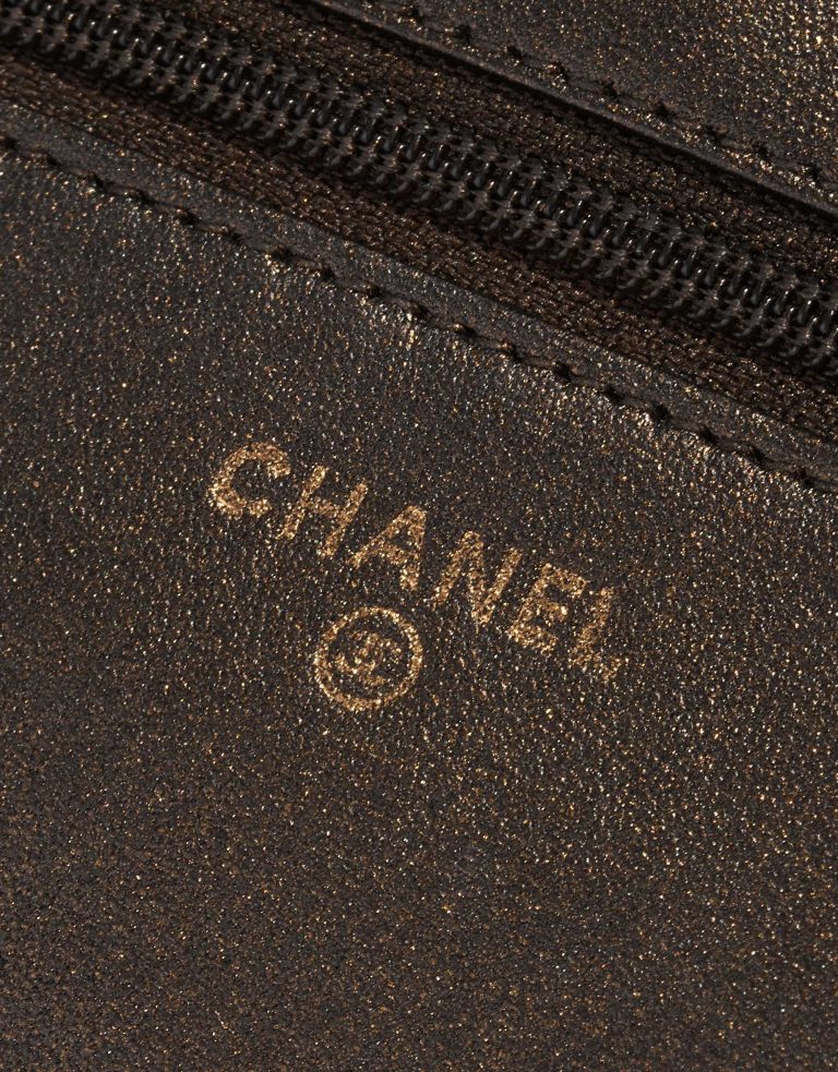Pre-owned Chanel bag WOC Lamb Camellia Black / Shimmering Gold Black Logo | Sell your designer bag on Saclab.com