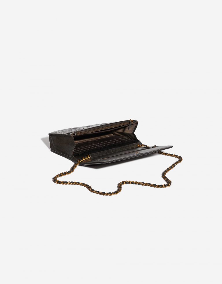 Pre-owned Chanel bag WOC Lamb Camellia Black / Shimmering Gold Black Inside | Sell your designer bag on Saclab.com