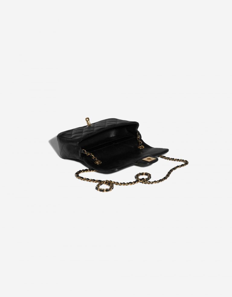 Pre-owned Chanel bag Victory Peace Flap Bag Mini Lamb Black Black Inside | Sell your designer bag on Saclab.com