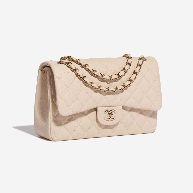Pre-owned Chanel bag Timeless Jumbo Caviar Light Beige Beige Side Front | Sell your designer bag on Saclab.com