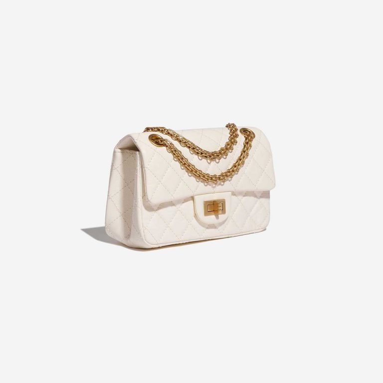 Pre-owned Chanel bag 2.55 Reissue Mini Aged Calfskin Ivory White Side Front | Sell your designer bag on Saclab.com