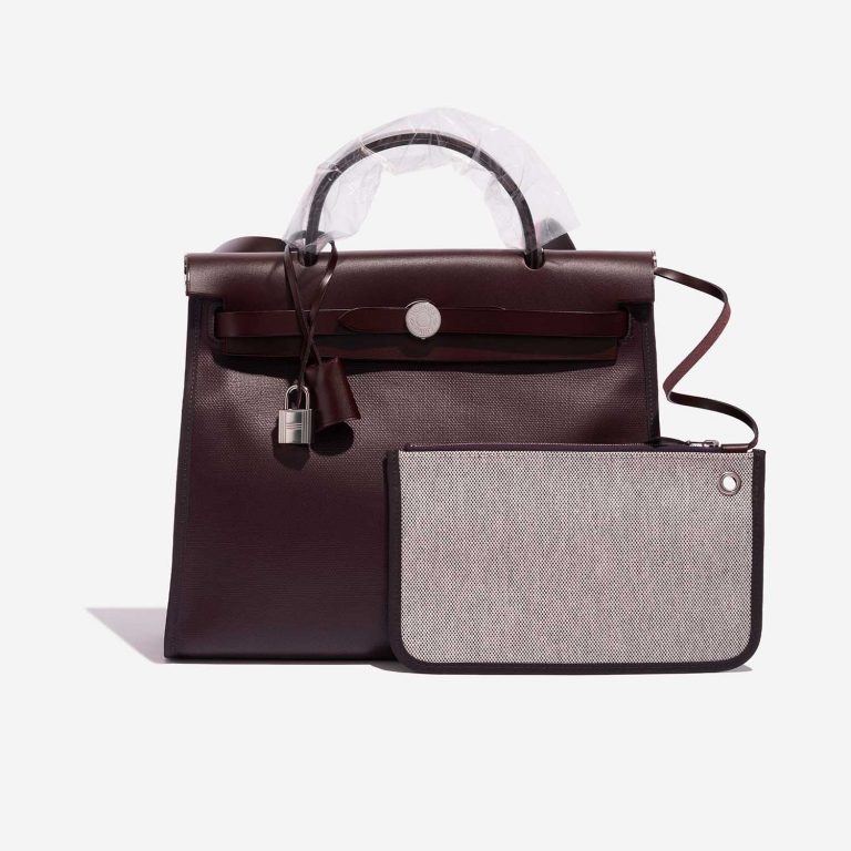 Pre-owned Hermès bag Herbag 31 Vache Hunter / Coated Toile / Toile  Rouge Sellier / Cassis / Écru / Black Black, Red Front | Sell your designer bag on Saclab.com