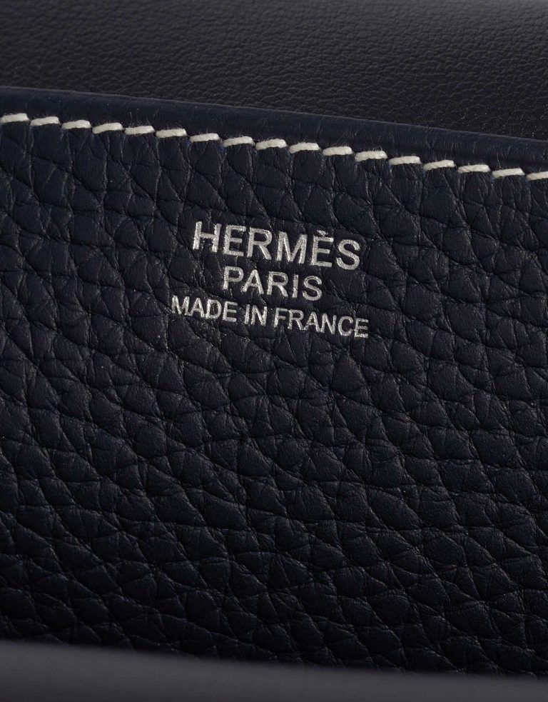 Pre-owned Hermès bag Halzan 31 Clemence Bleu Nuit / Black Black, Blue Logo | Sell your designer bag on Saclab.com