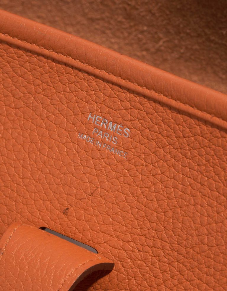 Pre-owned Hermès bag Evelyne 33 Taurillon Clemence Orange H Orange Logo | Sell your designer bag on Saclab.com