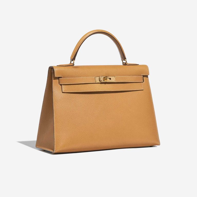 Pre-owned Hermès bag Kelly 32 Ardennes Moutarde Beige Side Front | Sell your designer bag on Saclab.com