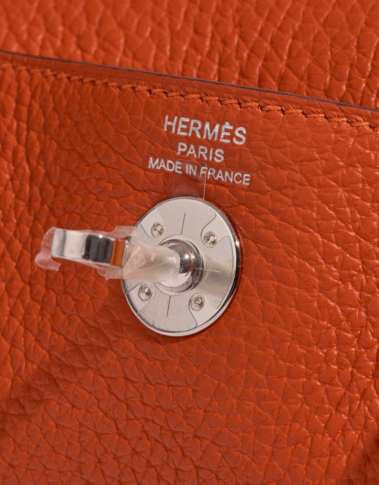 Pre-owned Hermès bag Lindy 20 Mini Taurillon Clemence Feu Orange Logo | Sell your designer bag on Saclab.com