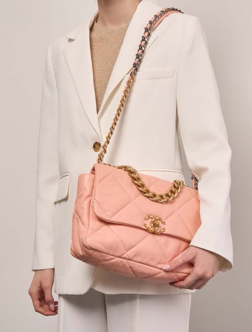 Chanel 19 Flap Bag Large Lamb Peach on Model | Sell your designer bag