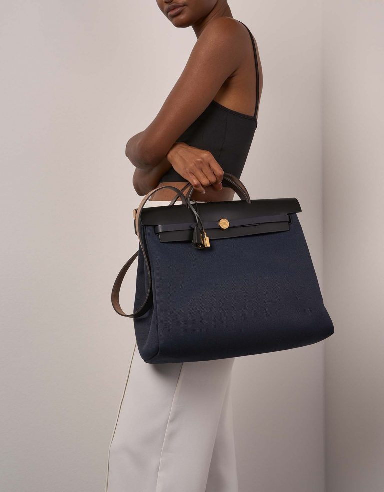Pre-owned Hermès bag Herbag 39 Toile / Vache Hunter Black / Bleu Marine Black, Blue | Sell your designer bag on Saclab.com
