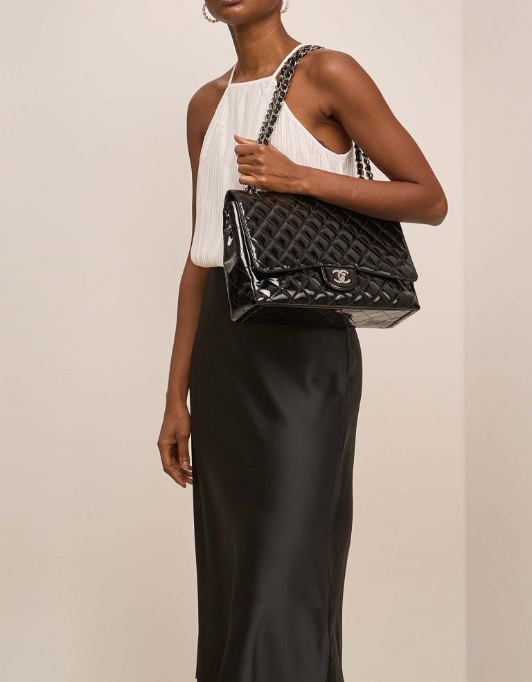 Chanel Timeless Maxi Black on Model | Sell your designer bag on Saclab.com