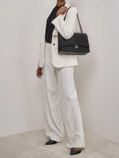 Chanel Timeless Maxi Lamb Black on Model | Sell your designer bag