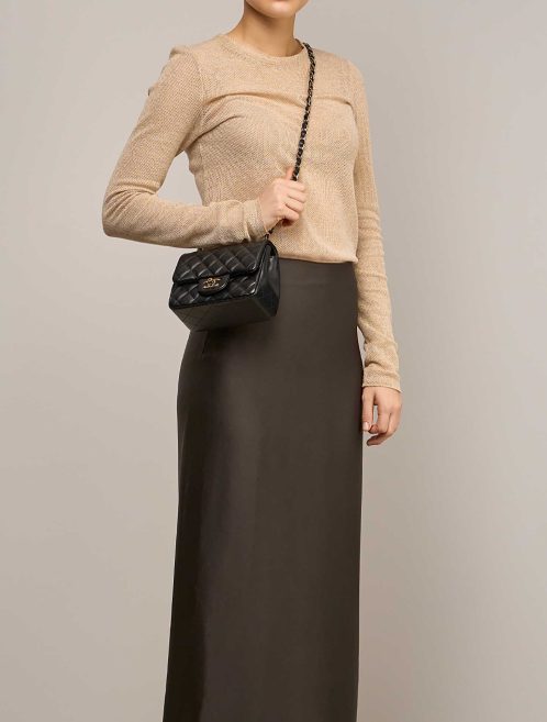 Chanel Timeless Mini Square Lamb Black on Model | Sell your designer bag