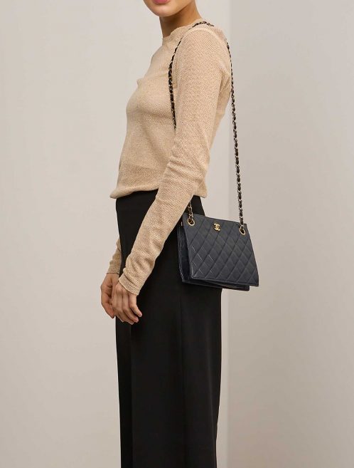 Chanel Clutch Lamb Black on Model | Sell your designer bag