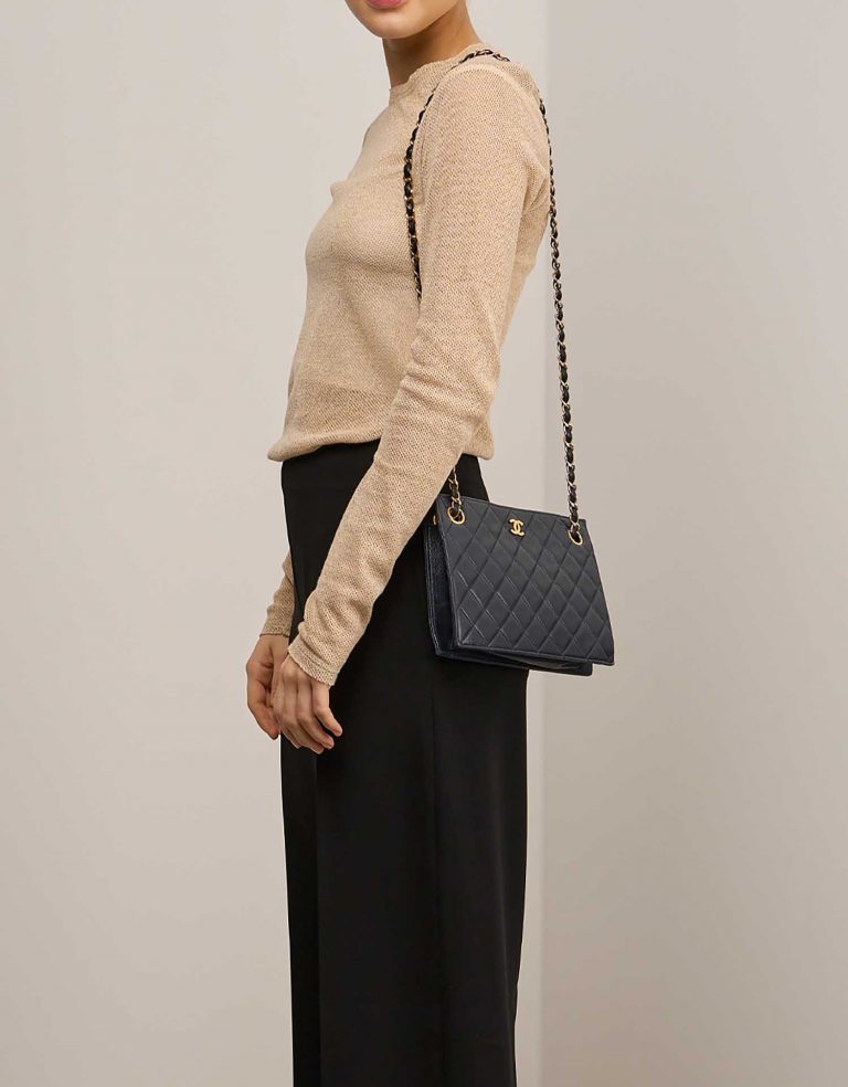 Chanel Clutch Lamb Black on Model | Sell your designer bag