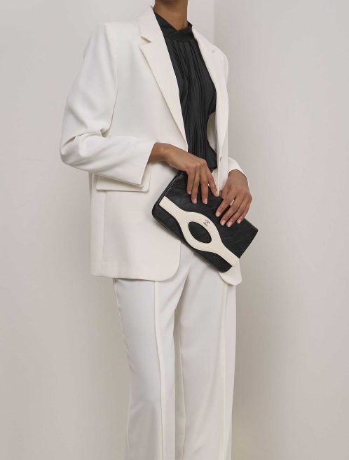 Chanel 31 Clutch Aged Calf Black / White on Model | Sell your designer bag