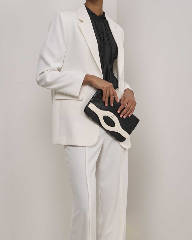 Chanel 31 Clutch Aged Calf Black / White on Model | Sell your designer bag