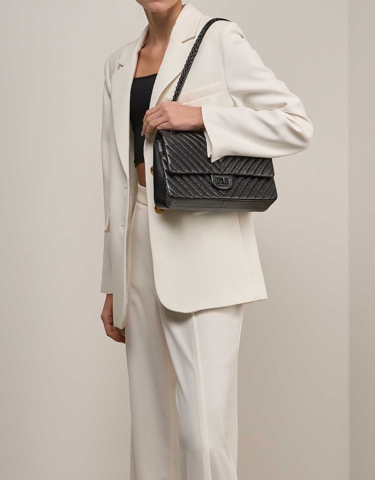 Chanel 2.55 Reissue 226 Aged Calf Black on Model | Sell your designer bag