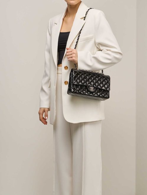 Chanel Timeless Medium Patent Black on Model | Sell your designer bag