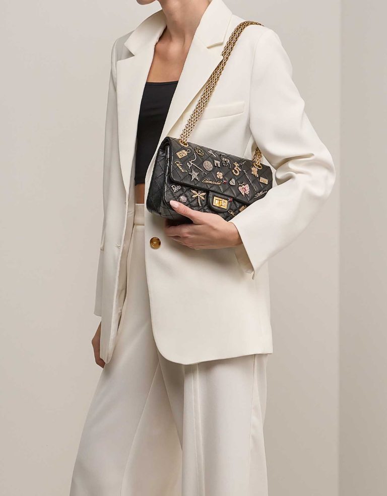 Chanel 2.55 Reissue 225 Aged Calf Black on Model | Sell your designer bag