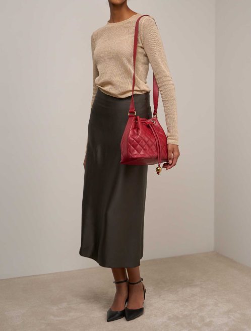 Chanel Drawstring Caviar Red on Model | Sell your designer bag