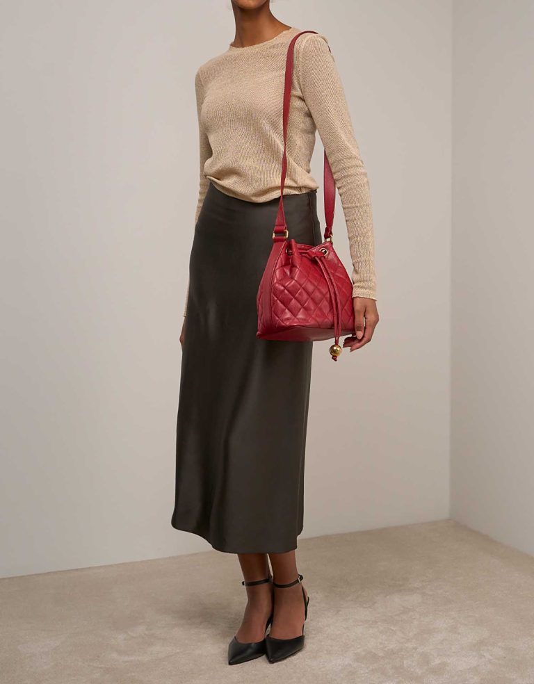 Chanel Drawstring Caviar Red on Model | Sell your designer bag