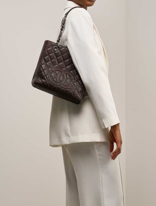 Chanel Shopping Tote PST Caviar Dark Brown on Model | Sell your designer bag