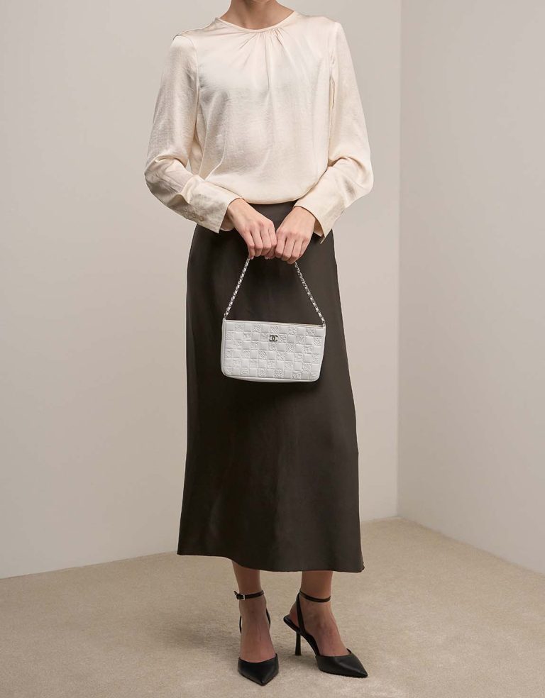 Chanel Clutch With Chain Small Lamb White on Model | Sell your designer bag