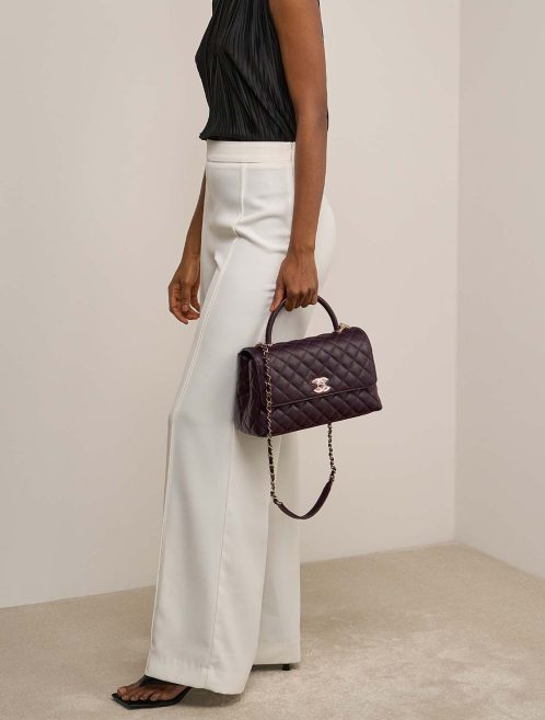 Chanel Timeless Handle Medium Caviar Dark Plum on Model | Sell your designer bag