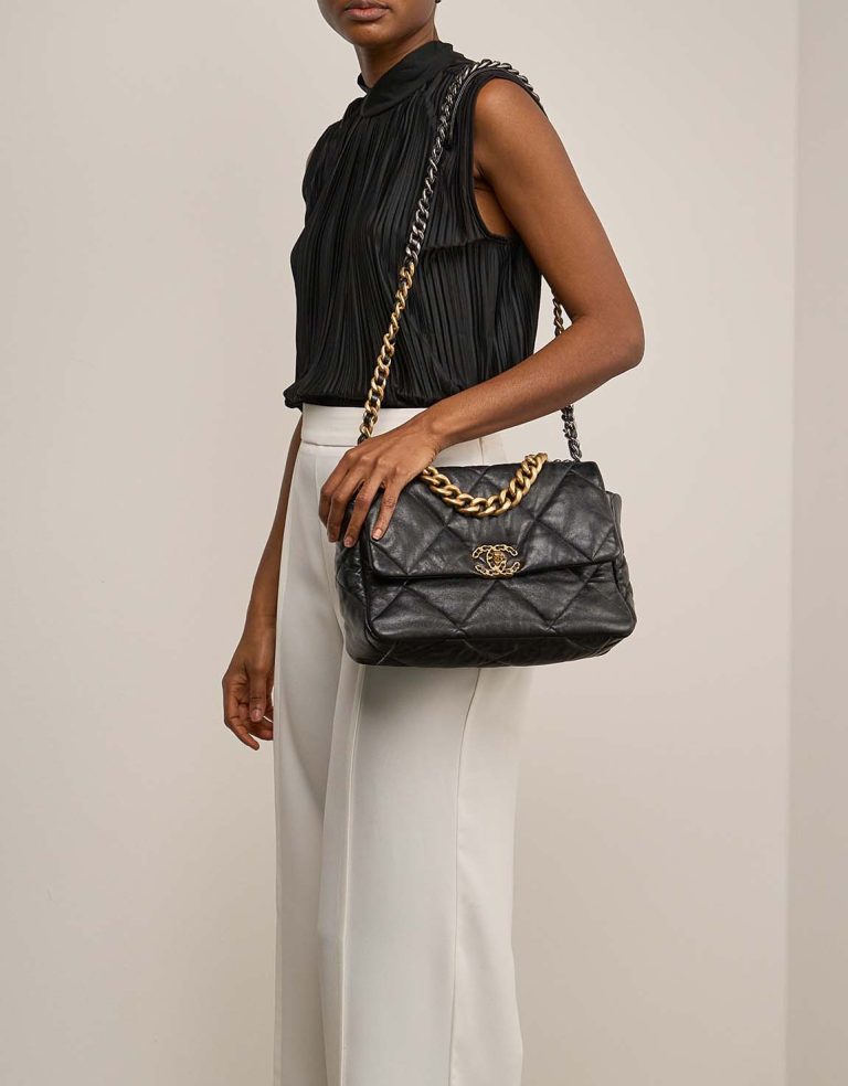 Chanel 19 Flap Bag Large Lamb Black on Model | Sell your designer bag