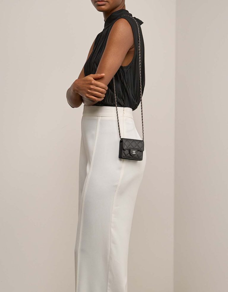 Chanel Timeless Extra Mini Caviar Black on Model | Sell your designer bag