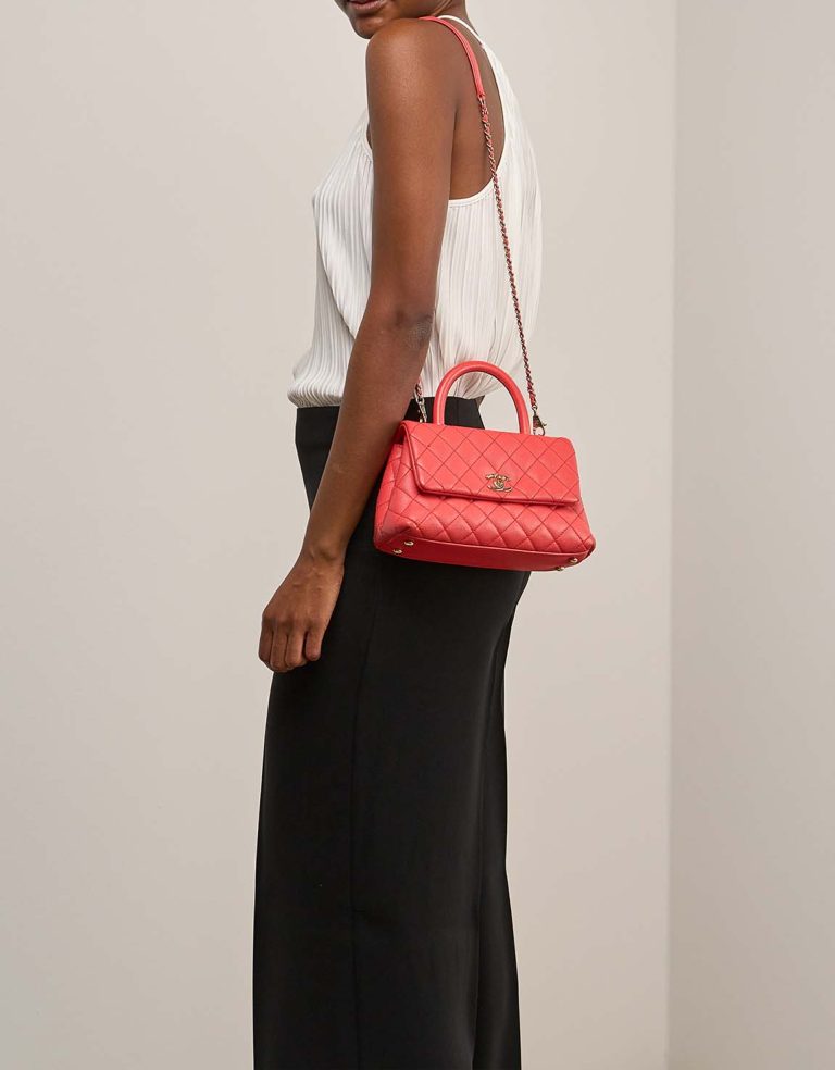 Chanel Timeless Handle Small Caviar Coral on Model | Sell your designer bag