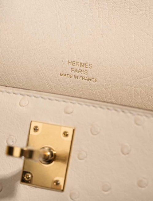 Hermès Kelly Pochette Mini Ostrich Nata Logo | Sell your designer bag