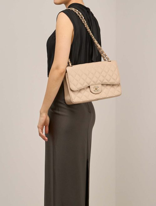 Chanel Timeless Jumbo Caviar Beige on Model | Sell your designer bag