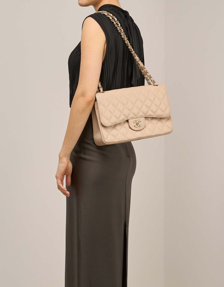 Chanel Timeless Jumbo Caviar Beige on Model | Sell your designer bag