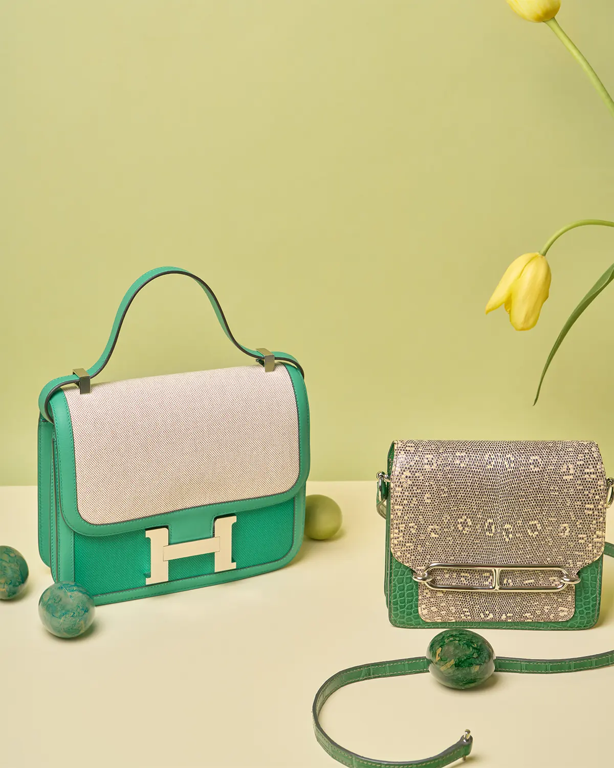 A Constance 24 from Swift and Toile in Vert Jade & a Roulis 18 from Ombre Lizard and Matte Alligator in Vert Cactus, sold on saclab.com
