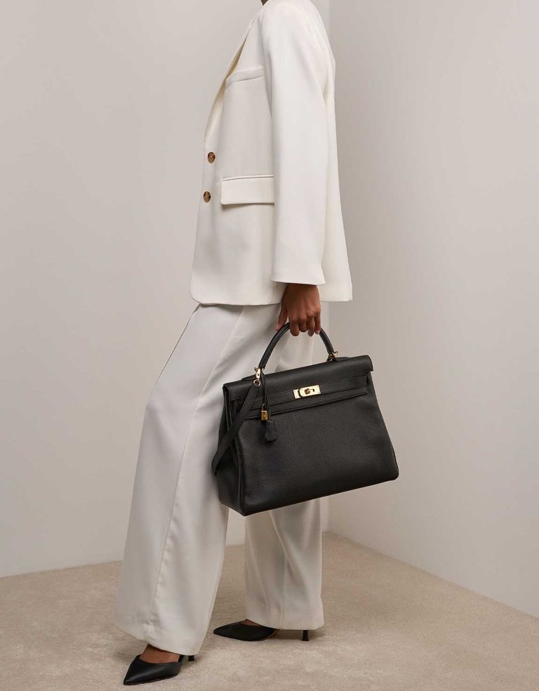 Hermès Kelly 40 Togo Black on Model | Sell your designer bag
