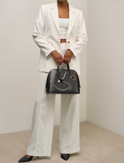Hermès Bolide 1923 Smile 30 Tadelakt / Niloticus Lizard Black on Model | Sell your designer bag